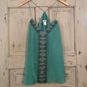 Adorable turquoise top!  Does have couple spots!
